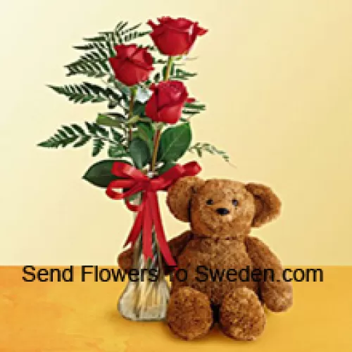 3 Red Roses With Some Ferns In A Glass Vase Along With A Cute 12 Inches Tall Teddy Bear