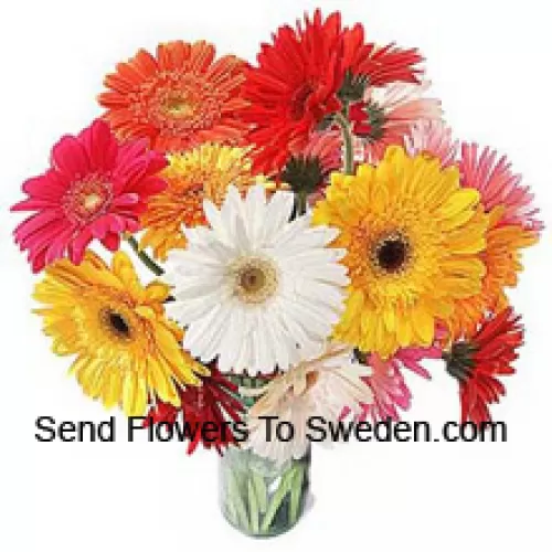 19 Mixed Colored Gerberas With Some Ferns In A Glass Vase
