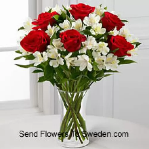 7 Red Roses With Assorted White Flowers And Fillers In A Glass Vase