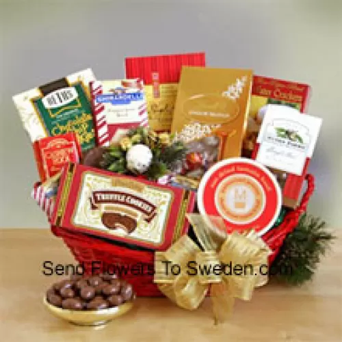Everyone on your gift list this year will appreciate our gourmet sampler gift basket, whether it's family, friends, or business associates you need to please. Our handsome red oval basket comes decorated with a big bow and holiday greenery to make a great presentation. Inside are many reasons to smile as they sample the savory and sweet selection: crackers, cheese, Cashew Roca, truffle cookies, mocha almonds, chocolate chip cookies, Lindt truffles, Ghirardelli almond chocolate bar, and English tea cookies. (Please Note That We Reserve The Right To Substitute Any Product With A Suitable Product Of Equal Value In Case Of Non-Availability Of A Certain Product)